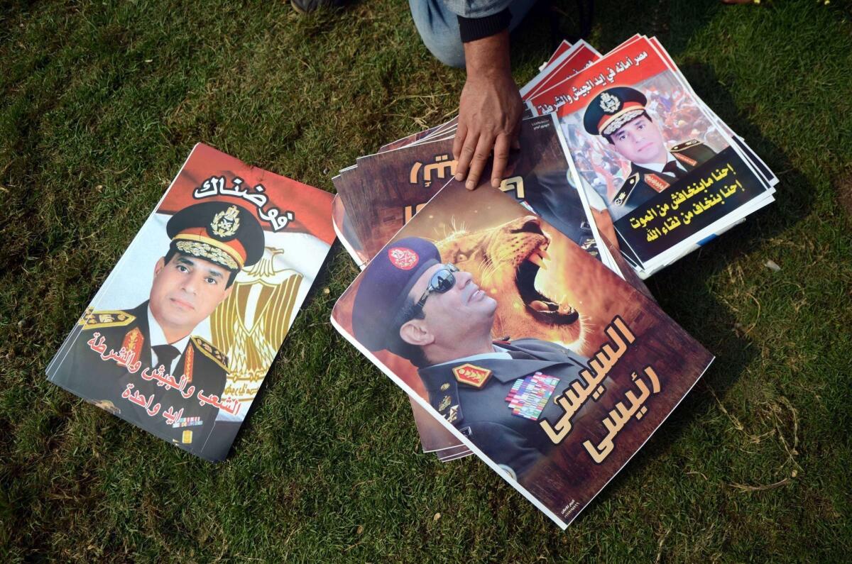 A street vendor sells portraits of Egypt's military chief, Gen. Abdel Fattah Sisi, who has become a symbol of hope for order and stability after nearly three years of unrest.