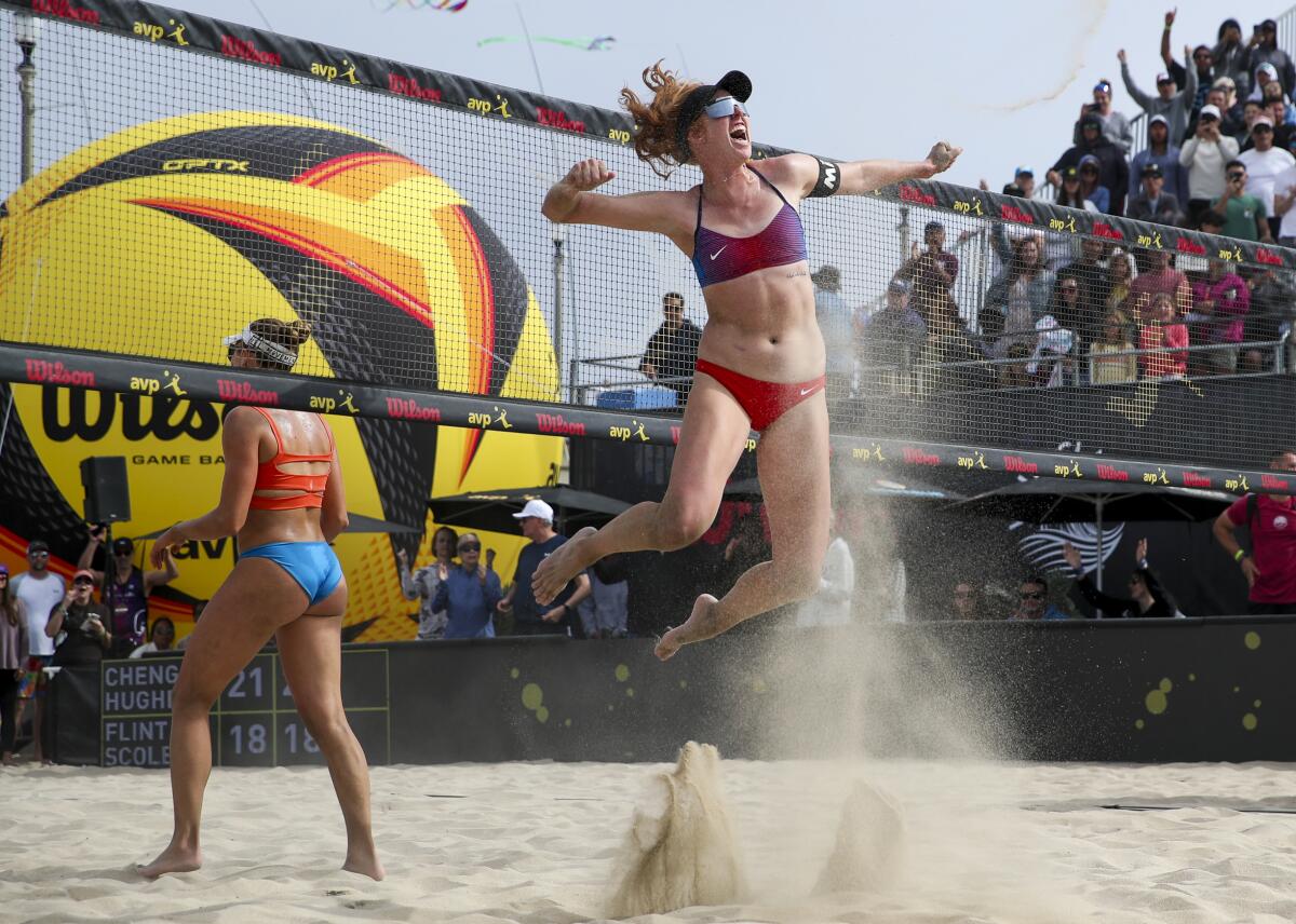 Kelly Cheng celebrates immediately after she and teammate Sara Hughes win the AVP Huntington Beach Open.