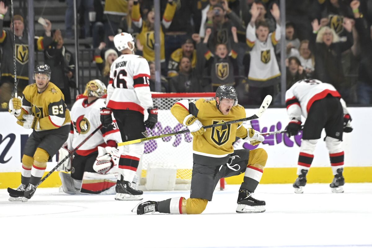 Vegas Golden Knights center Jack Eichel (9) reacts after scoring a goal against the Ottawa Senators during the third period of an NHL hockey game Sunday, March 6, 2022, in Las Vegas. (AP Photo/David Becker)