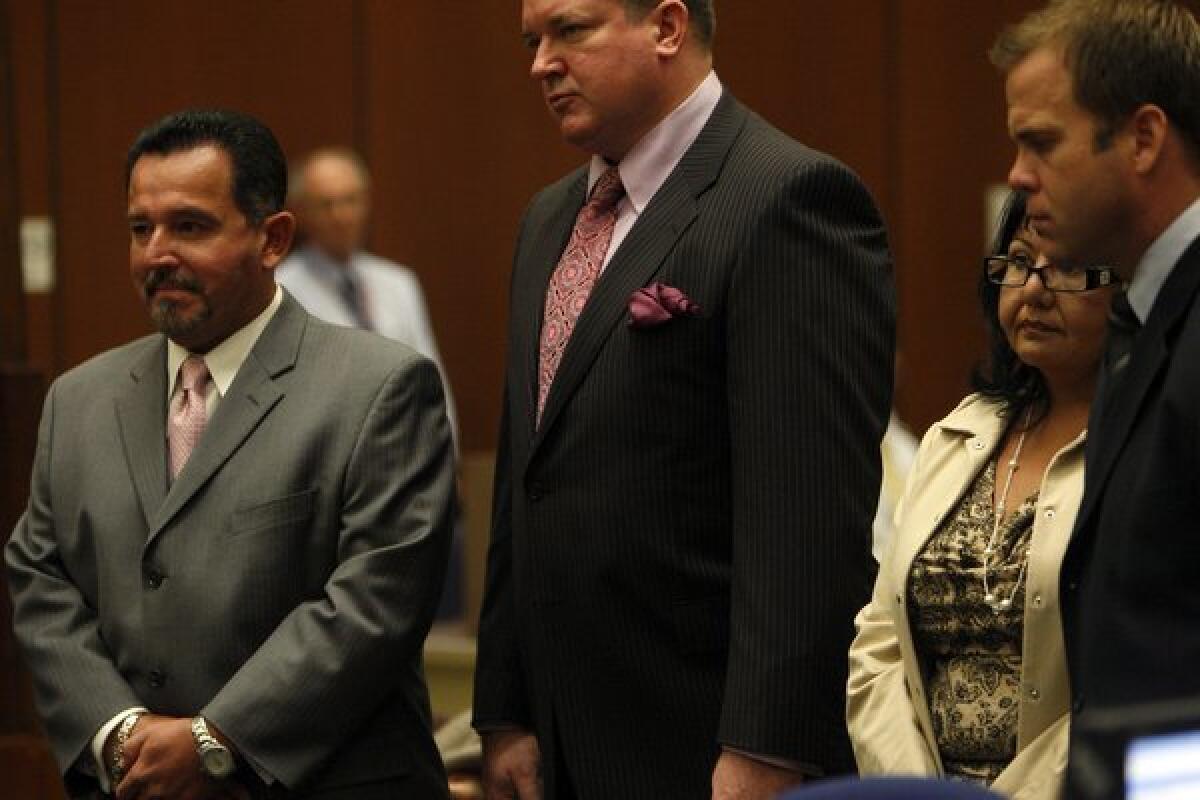 Irwindale City Councilman Mark Breceda, left, and former Councilwoman Rosemary Ramirez, second from right, faced charges of misappropriation of public funds.