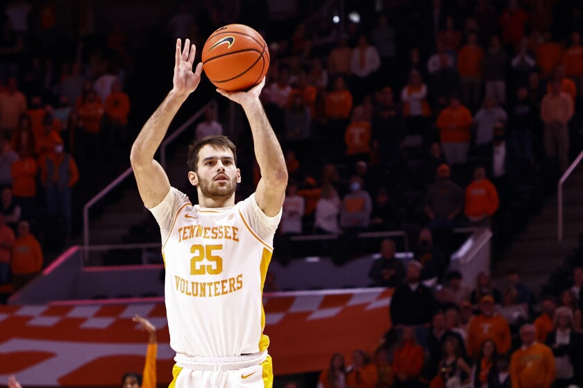 Tennessee's Santiago Vescovi shoots a 3-point shot during the first half of an NCAA college basketball game against Florida, Wednesday, Jan. 26, 2022, in Knoxville, Tenn. (AP Photo/Wade Payne)
