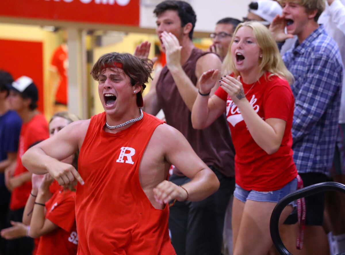 A Redondo Union fan reacts after the Sea Hawks won a point during a girls' volleyball match earlier this season.