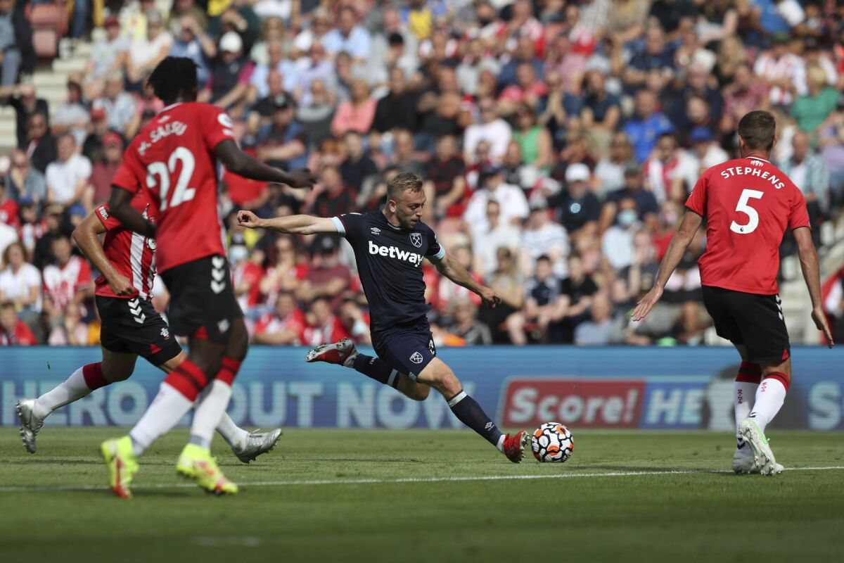 West Ham United's Jarrod Bowen shoots at goal, during the English Premier League soccer match between Southampton and West Ham United, at St Mary's Stadium, in Southampton, England, Saturday, Sept. 11, 2021. (Kieran Cleeves/PA via AP)