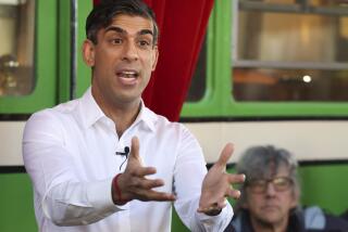 Britain's Prime Minister Rishi Sunak gestures during his visit to The Boatyard in Leigh-on-Sea, Essex, England, Monday Jan. 15, 2024. (Phil Harris/Pool Photo via AP)