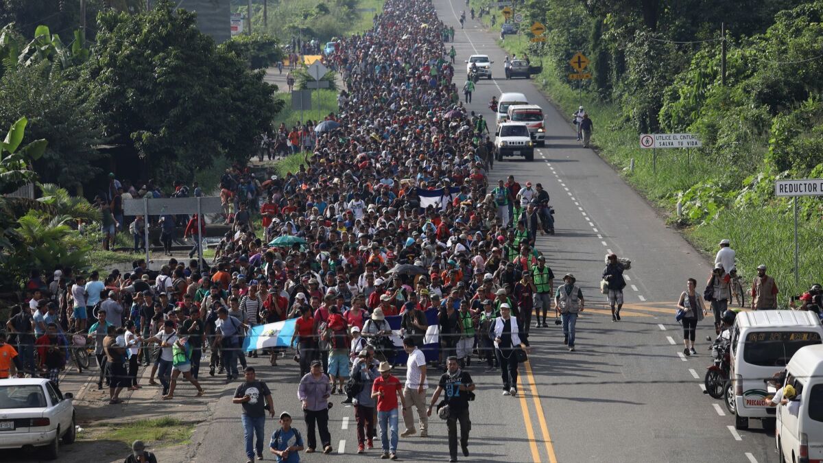 A migrant caravan walks into the interior of Mexico after crossing the Guatemalan border near Ciudad Hidalgo, Mexico.