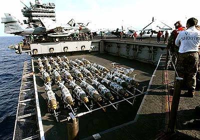Joint Direct Attack Munitions are transported to the flight deck of the USS Harry S. Truman in the Mediterranean Sea.