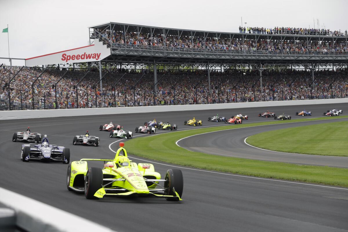 Simon Pagenaud leads the field through the first turn on the start of the 2019 Indianapolis 500.