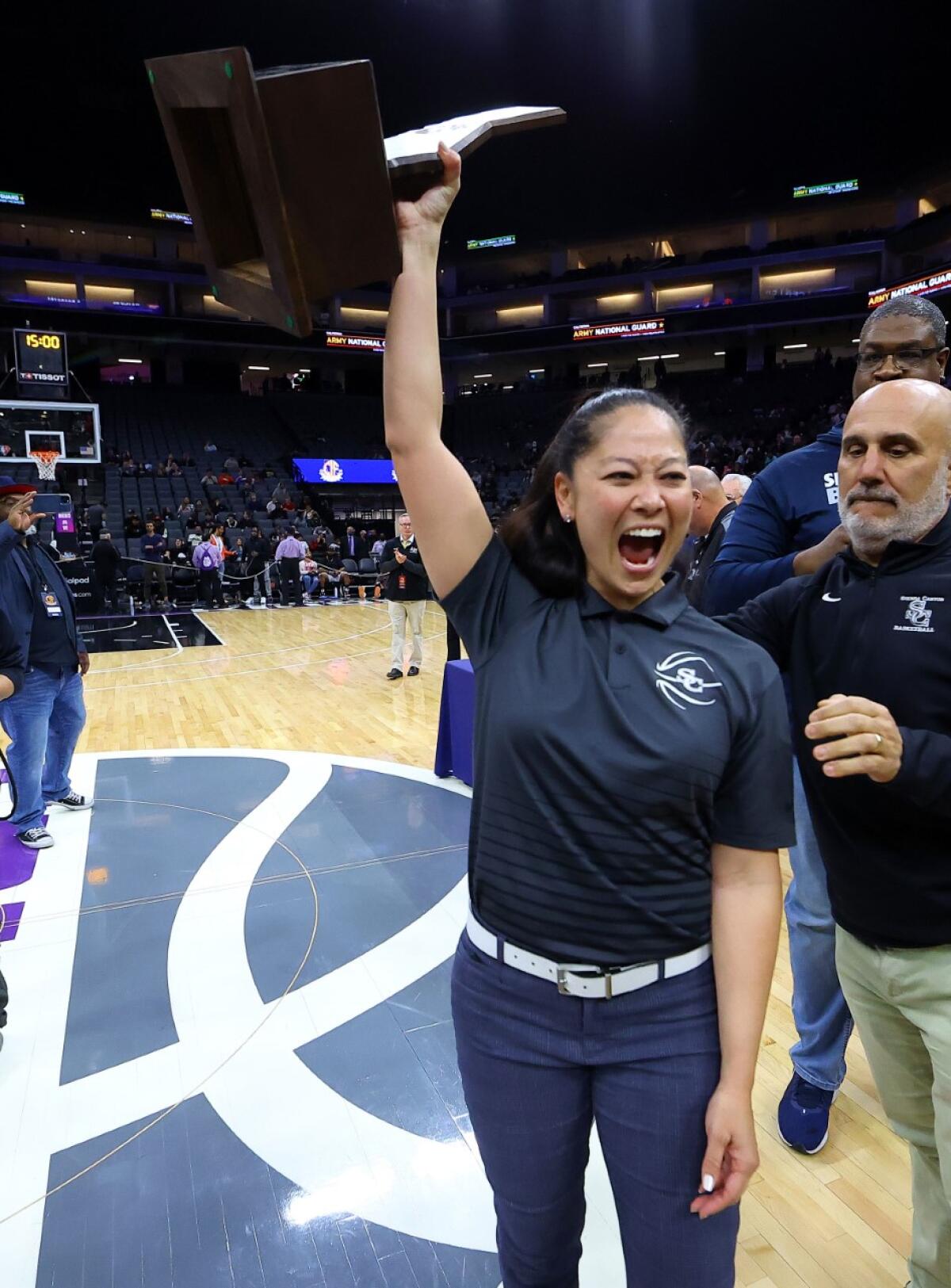 Coach Alicia Komaki celebrates after Sierra Canyon wins state Open Division girls' basketball title.