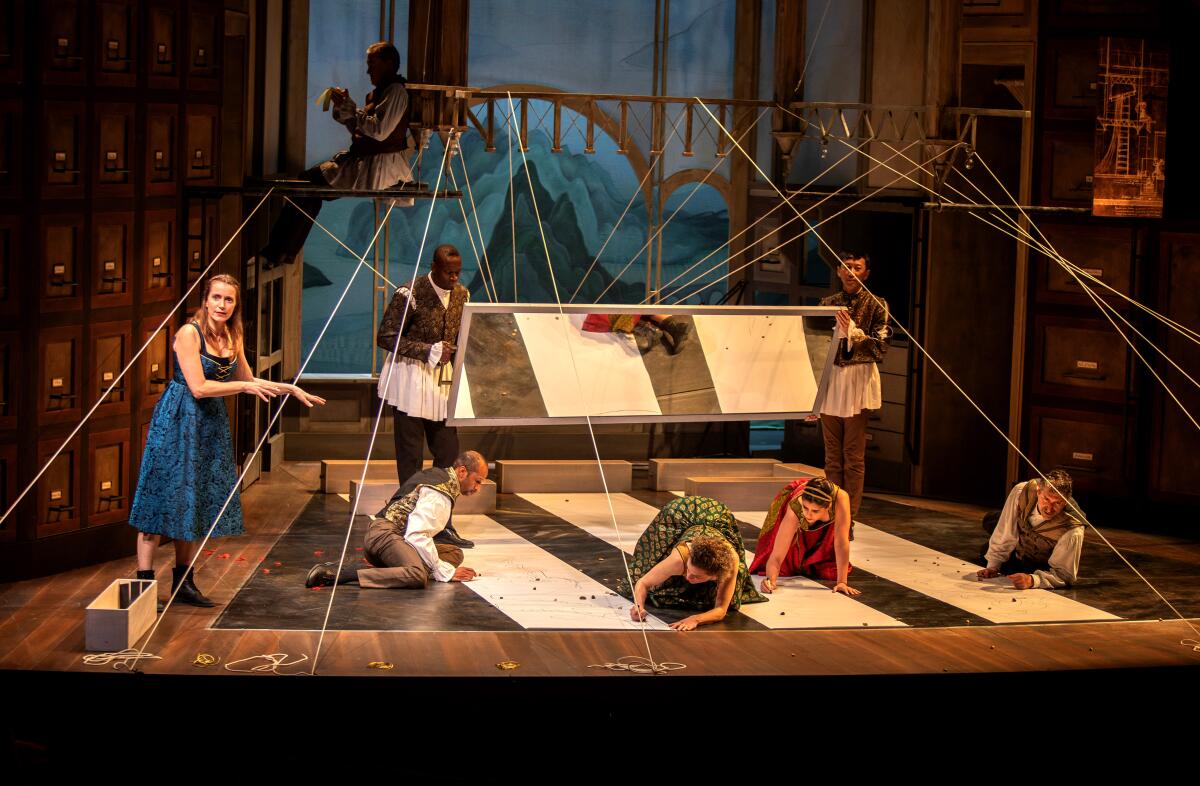 The cast performs inside a wooden structure in "The Notebooks of Leonardo da Vinci"