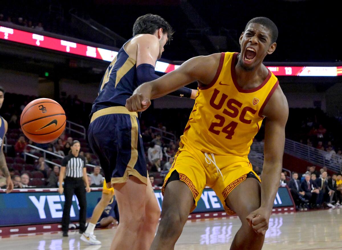 USC forward Joshua Morgan celebrates after a dunk in the first half against Mount St. Mary's.