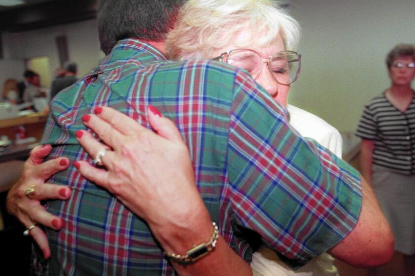 Dennis and Ione Huber hugged in Orange County Superior Court in 1997 after the death penalty was handed down to John J. Famalaro, the convicted killer of their daughter, Denise Huber.