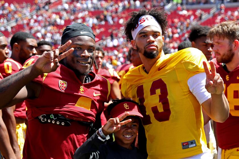 LOS ANGELES, CA - APRIL 23: USC wide receiver Mario Williams (4) and USC quarterback Caleb Williams.