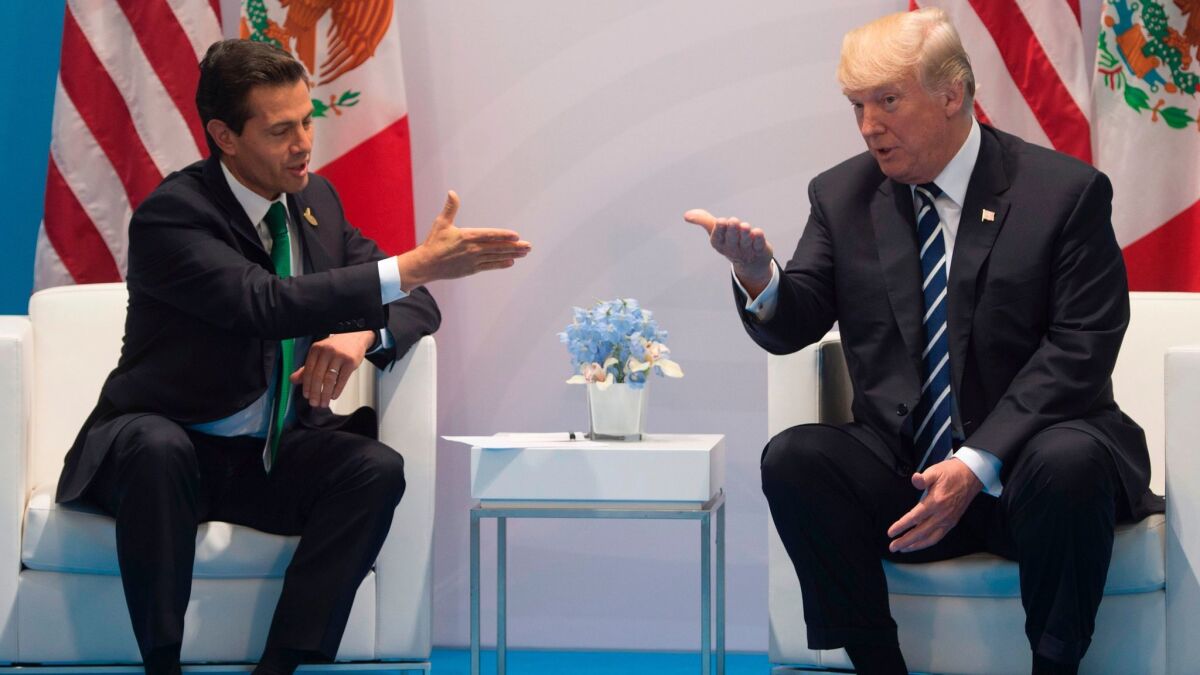 President Trump and Mexican President Enrique Peña Nieto meet on the sidelines of the G20 summit in Hamburg, Germany, on Friday.