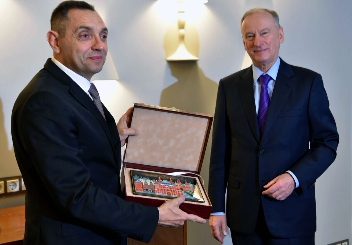 In this photo provided by the Serbian Interior Ministry, Serbian Interior Minister Aleksandar Vulin, left, poses with Nikolai Patrushev, secretary of the Kremlin's Security Council, in Moscow, Russia, on Friday, Dec. 3, 2021. Serbia and Russia pledged Friday to combat "color revolutions" they said are instruments of the West to destabilize "free states," according to a statement issued by Serbia's interior minister. (Serbian Interior Ministry Press Service via AP)