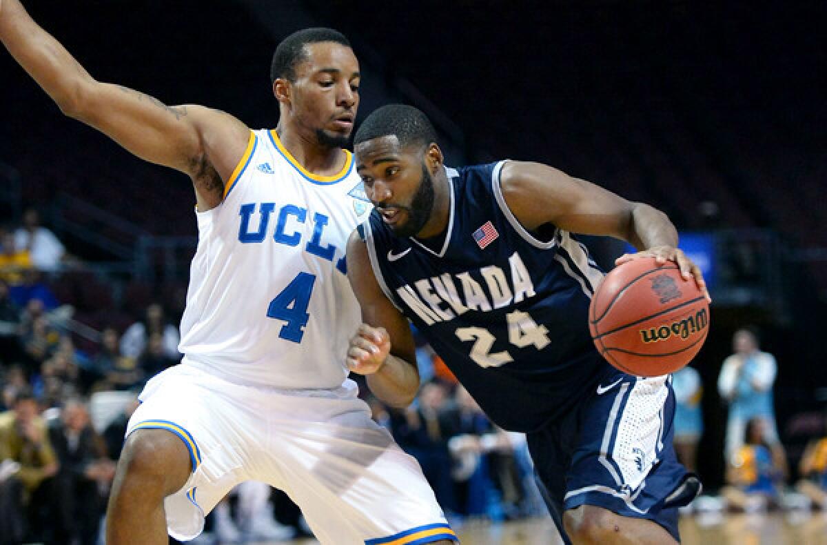 UCLA guard Norman Powell tries to cut off a drive by Nevada guard Deonte Burton during their game Thursday in Las Vegas.