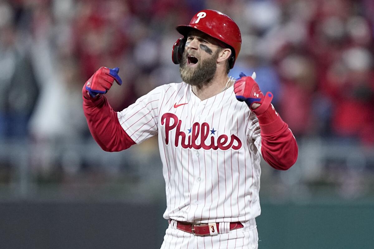 Philadelphia's Bryce Harper celebrates after hitting a run-scoring double in the fifth inning.