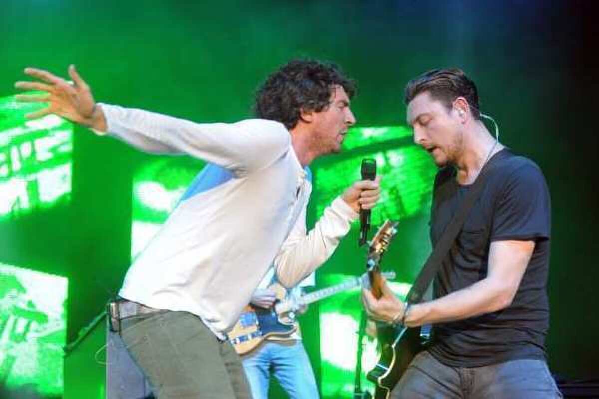 Snow Patrol singer Gary Lightbody, left, and guitarist Nathan Connolly will be able to play until 1 a.m. in London's Hyde Park for the opening ceremony of the Summer Olympics.