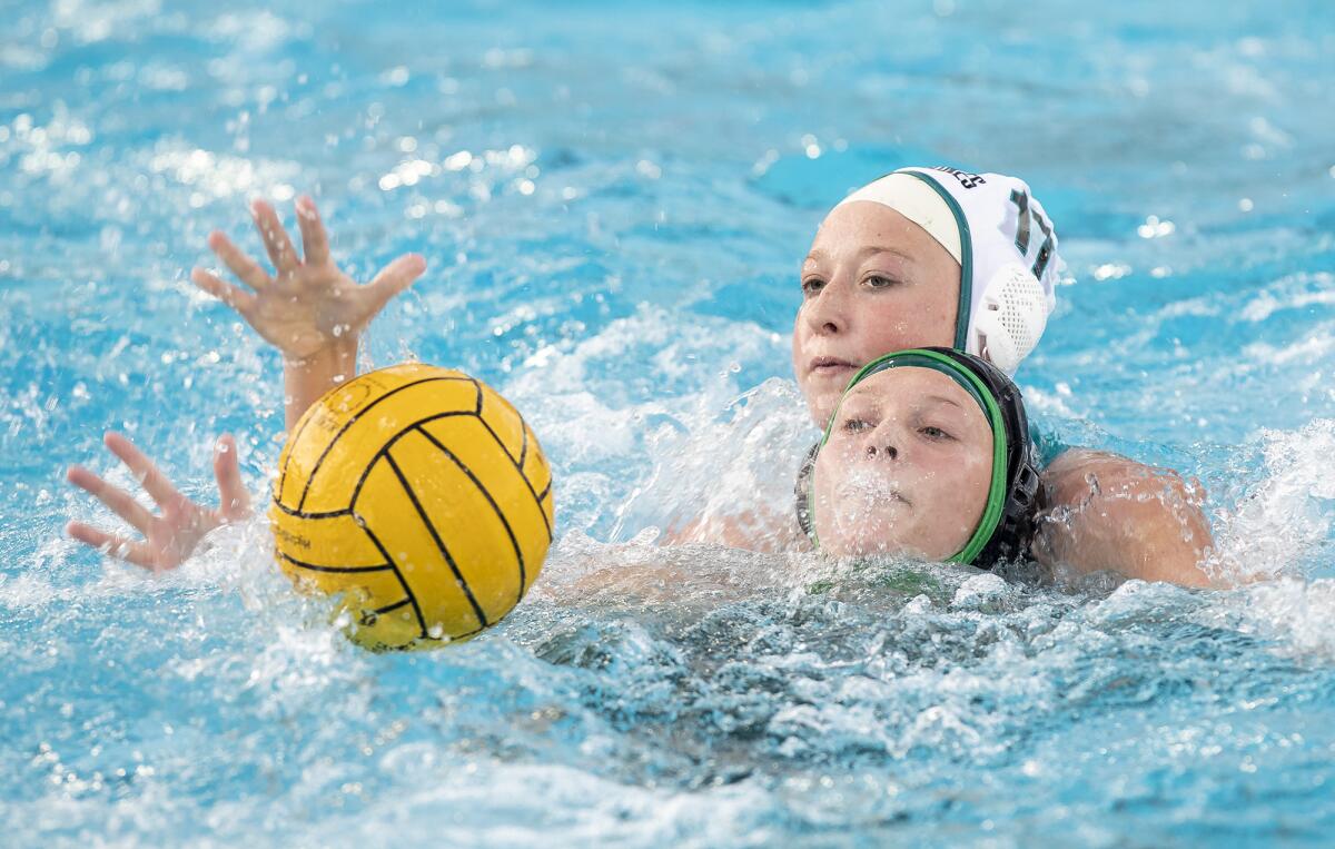 Costa Mesa's Aubree Jackson and Aliso Niguel's Emily Lipscomb battle for a ball during a CIF Division 3 playoff game.