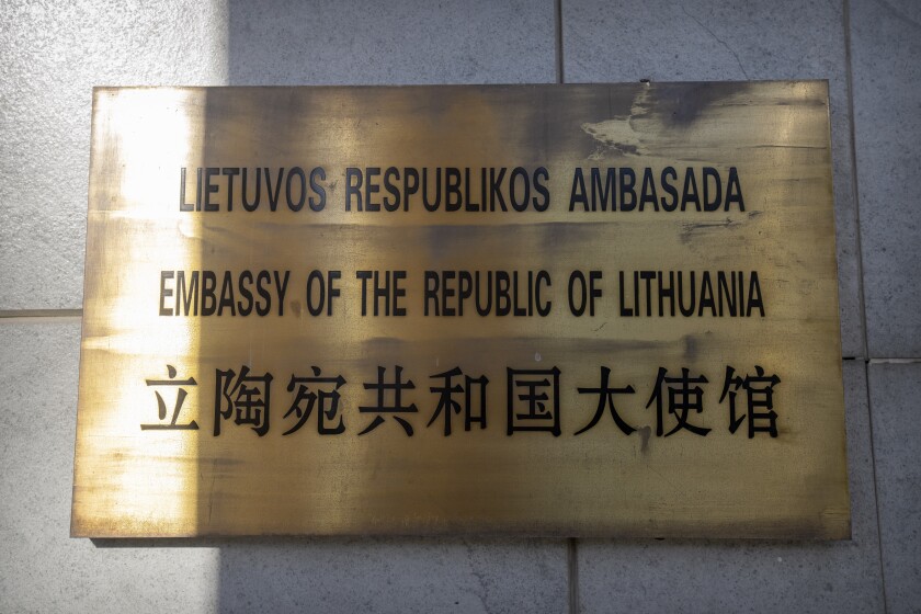 FILE - The nameplate for the Lithuanian Embassy is seen on the outside of the embassy building in Beijing, Thursday, Dec. 16, 2021. Beijing on Monday, Jan. 10, 2022, accused Washington of inciting Lithuania to “contain China" in a feud over the status of self-ruled Taiwan after U.S. officials expressed support for the European Union-member country in the face of Chinese economic pressure. (AP Photo/Mark Schiefelbein, File)