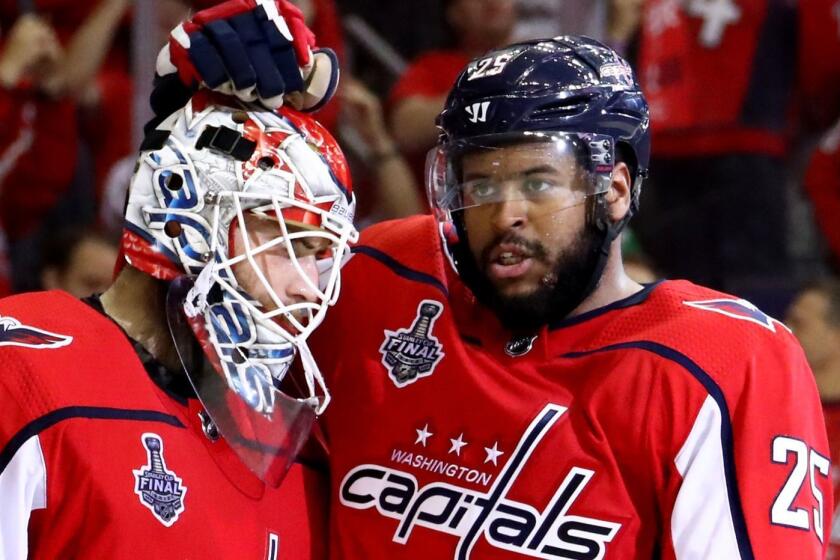 WASHINGTON, DC - JUNE 04: Braden Holtby #70 and Devante Smith-Pelly #25 of the Washington Capitals celebrate their team's 6-2 win over the Vegas Golden Knights in Game Four of the 2018 NHL Stanley Cup Final at Capital One Arena on June 4, 2018 in Washington, DC. (Photo by Gregory Shamus/Getty Images) ** OUTS - ELSENT, FPG, CM - OUTS * NM, PH, VA if sourced by CT, LA or MoD **