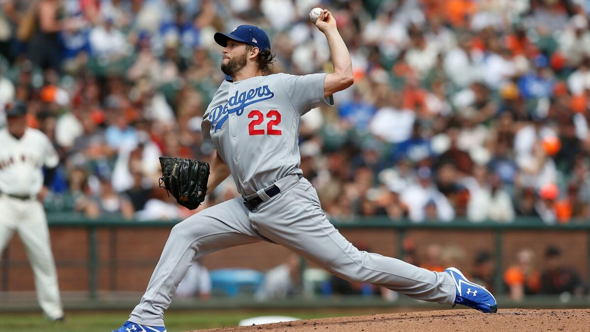 Dodgers pitcher Clayton Kershaw pitches in the bottom of the first inning against the San Francisco Giants at AT&T Park on Saturday in San Francisco.