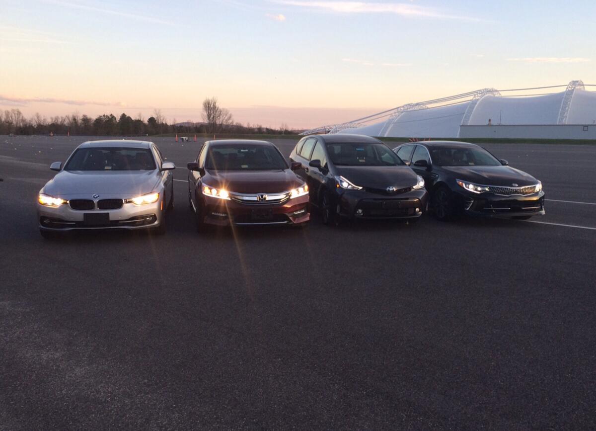 The Insurance Institute for Highway Safety tested cars' headlights at its facility in in Ruckersville, Va. From left, a BMW 3 series, Honda Accord, Toyota Prius v and a Kia Optima.