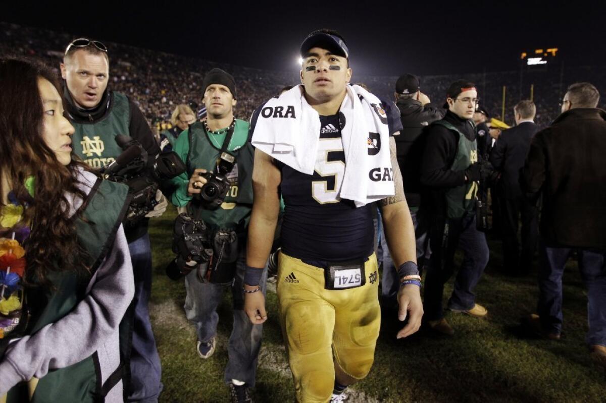 Manti Te'o walks off the field after a game earlier this season.