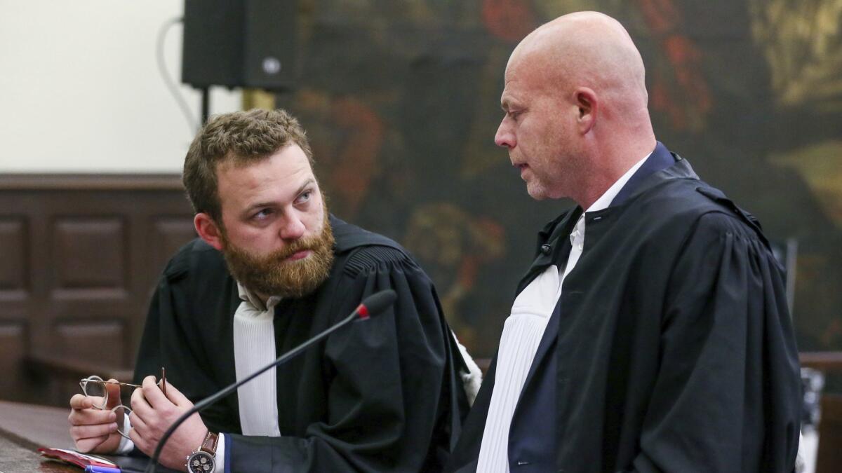 Lawyer for the accused, Sven Mary, right, attends the trial of Salah Abdeslam and Sofiane Ayari, in Brussels on April 23.