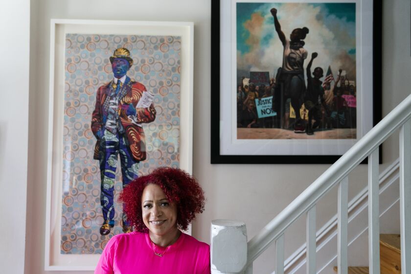 Nikole Hannah-Jones stands for a portrait at her home in the Brooklyn borough of New York