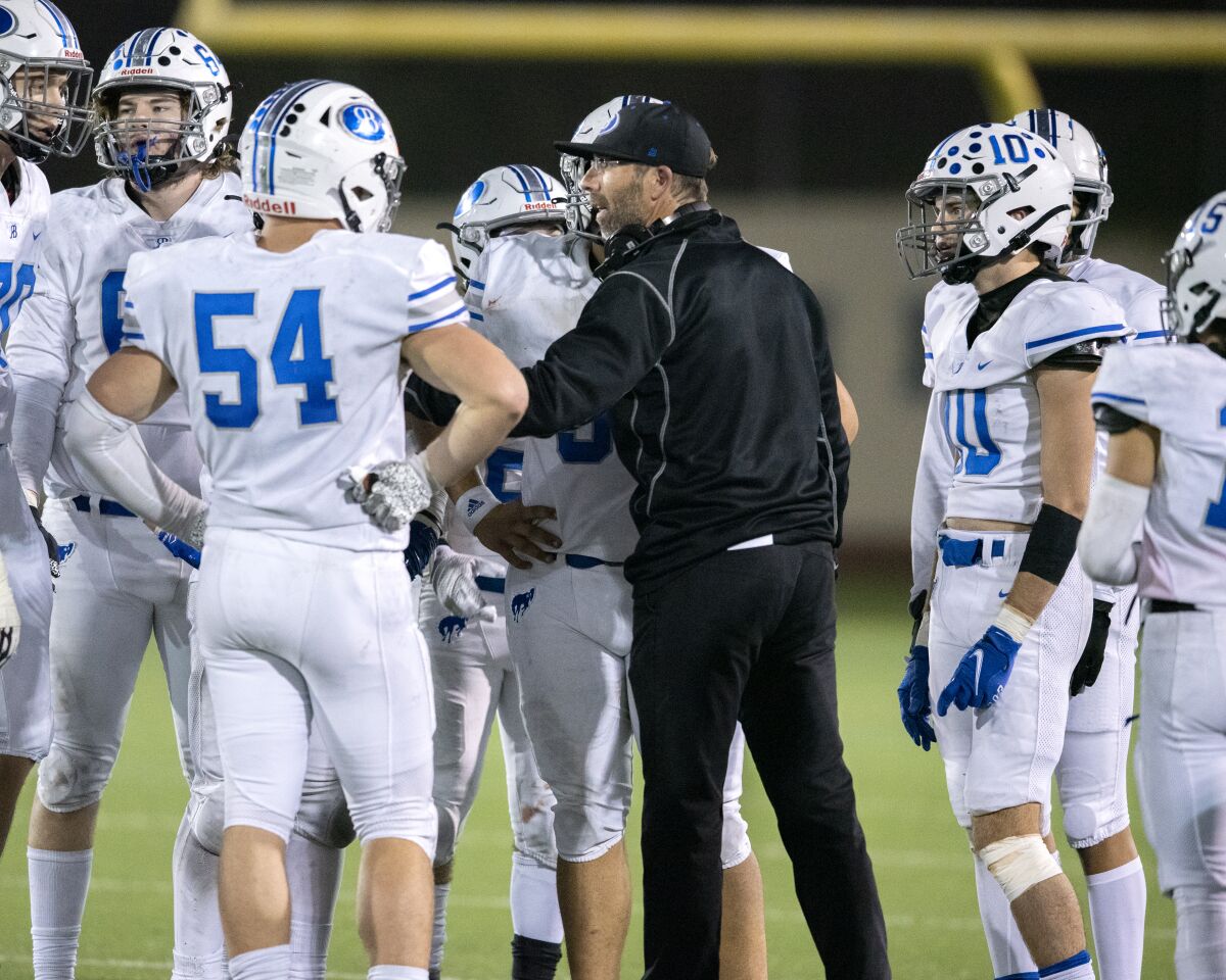 Tristan McCoy will hand over the reins of the Rancho Bernardo High football program to Eric Weddle at the end of the season. 