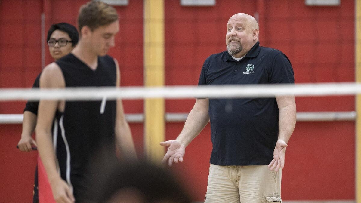 Todd Hanson, pictured gesturing in an Orange Coast League match on April 4, will no longer coach the Costa Mesa boys' and girls' volleyball teams.