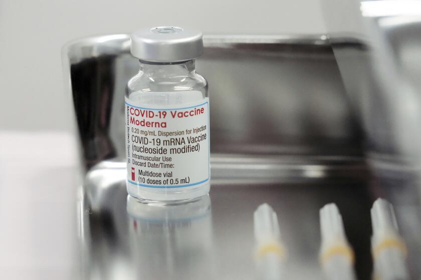 FILE - This June 14, 2021, file photo shows a Moderna COVID-19 vaccine vial that is being administered for flight attendants of Japan Airlines ar Haneda Airport in Tokyo. Japan’s health ministry said Thursday, Aug. 26, 2021 that it is suspending use of about 1.63 million doses of COVID-19 vaccine produced by Moderna Inc. after contamination was found in portions of unused vials, raising concern of a supply shortage as the country desperately tries to accelerate vaccinations amid the surge of infections. (AP Photo/Eugene Hoshiko, File)