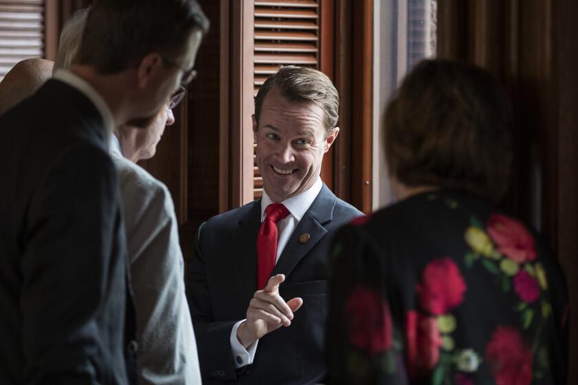House Speaker Dade Phelan, R-Beaumont, talks to Republican members of the Texas House before the start of the debate of Senate Bill 7, known as the Election Integrity Protection Act, at the Capitol on Sunday May 30, 2021, in Austin, Texas. (Jay Janner/Austin American-Statesman via AP)