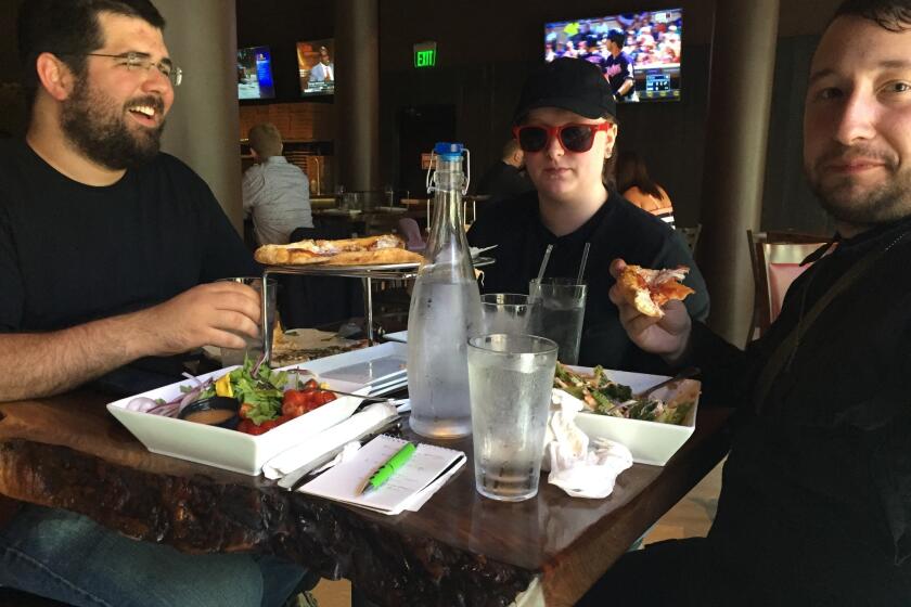 Matthew Heimbach, left, Katherine Amsel and Scott Hess, all members of the white nationalist Traditionalist Worker Party, eat lunch in Cleveland.