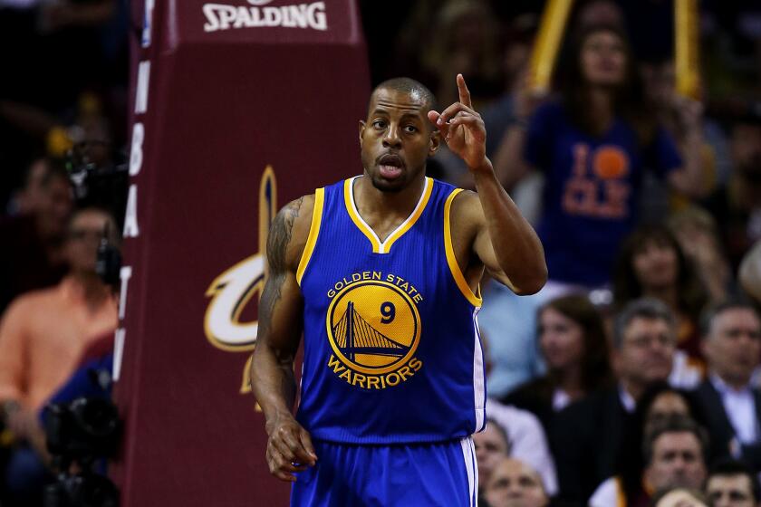 Warriors forward Andre Iguodala, who was selected most valuable player of the NBA Finals, acknowledges a teammate after scoring two of his 25 points against the Cavaliers in the third quarter of Game 6.