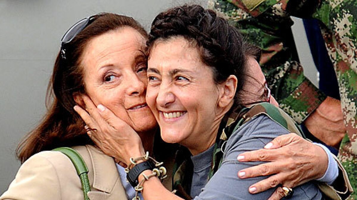 French-Colombian hostage Ingrid Betancourt, right, hugs her mother, Yolanda Pulecio, upon her arrival at the Catam air base in Bogota.