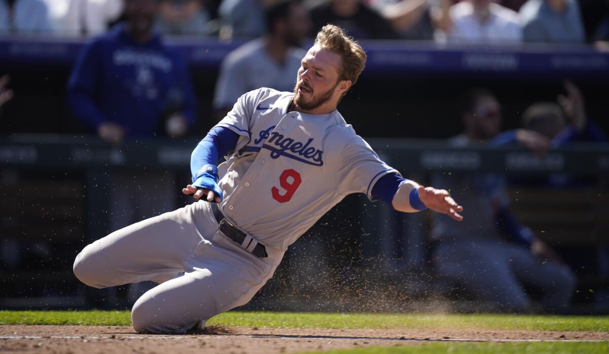 Dodgers second baseman Gavin Lux scores a run in the fourth inning against the Rockies on Friday.