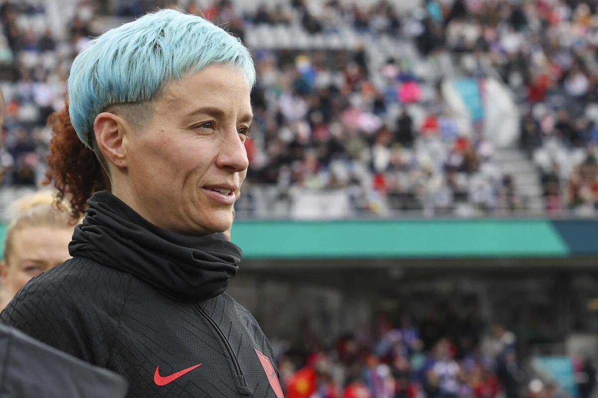 American soccer star Megan Rapinoe looks over the pitch.