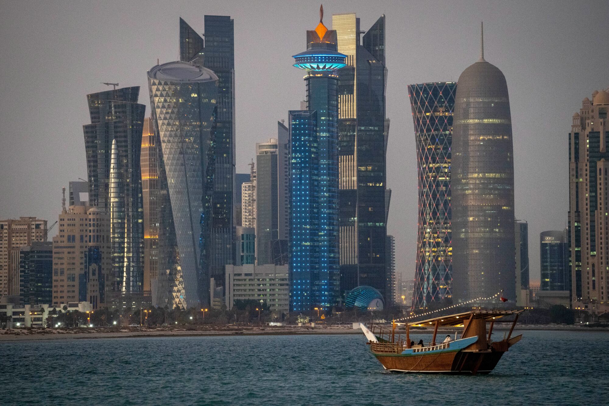 A traditional dhow boat floats in the bay outside Doha, Qatar, in November 2021.