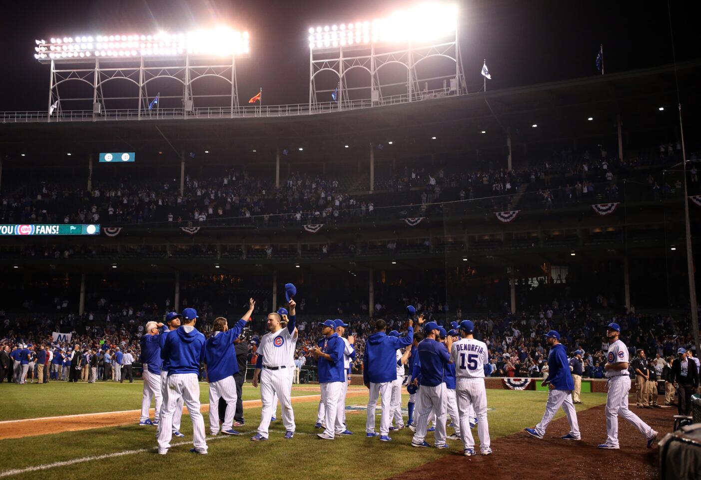 The Chicago Cubs acknowledge the fans after Game 4 of the National League Championship Series playoff Wednesday, Oct. 21, 2015 at Wrigley Field.
