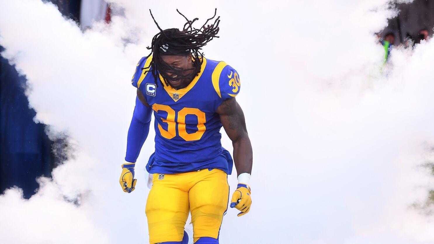 Los Angeles Rams running back Todd Gurley spits water as he sits