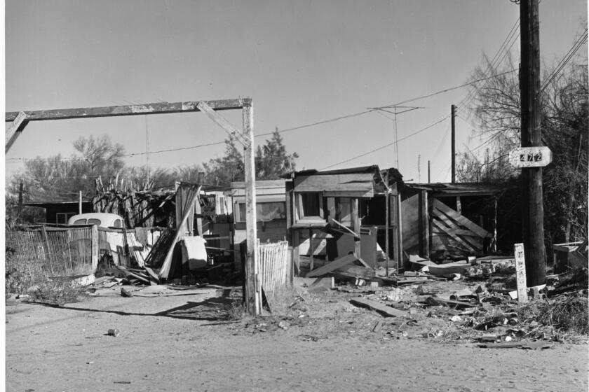 Undated file photo of residential structures on a parcel of land in downtown Palm Springs called Section 14. The land was owned by the indians, but the city, working with tribal leaders, demolished the structures in the early 1960's, displacing as many as 1,000 people, including hundreds of African–Americans. Photo by USC Library of Special Collections.