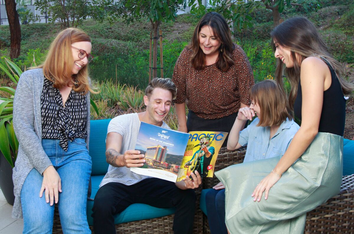 The team of PACIFIC Magazine reads the September 2019 issue together. (Not pictured: Katie Musolf)