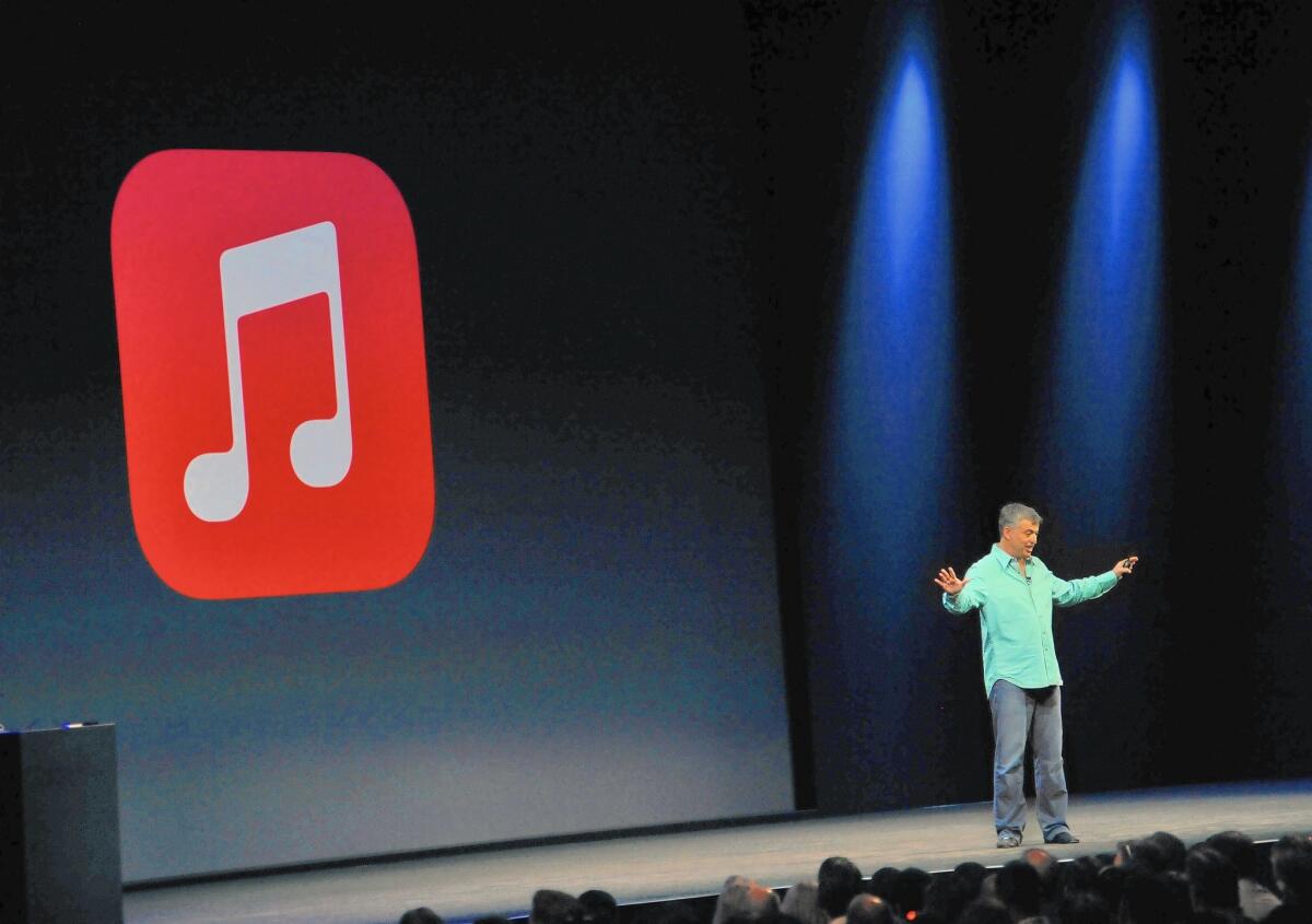 The recording industry is hoping Apple brings subscription-only streaming to the masses. Above, Apple executive Eddy Cue introduces iTunes Radio in 2013.