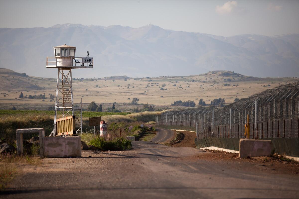 In this file photo, an unmanned U.N. watchtower stands on May 7, 2013, on the Israeli side of the border between the Israeli-annexed Golan Heights and Syria. Four U.N. peacekeepers were reportedly released after being held five days by Syrian rebels.