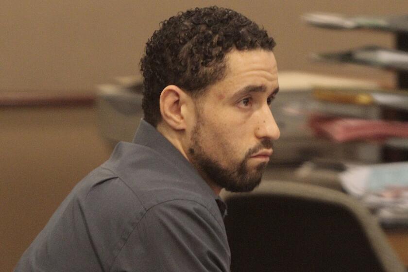 Alex Donald Jackson listens to testimony at his trial on murder charges in Los Angeles County Superior Court in Lancaster.