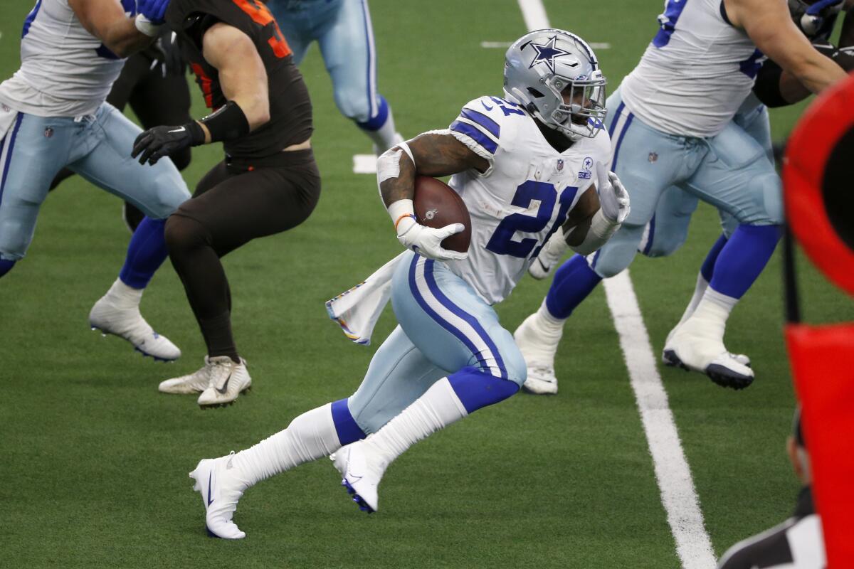 Dallas Cowboys running back Ezekiel Elliott carries the ball against the Cleveland Browns on Oct. 4.