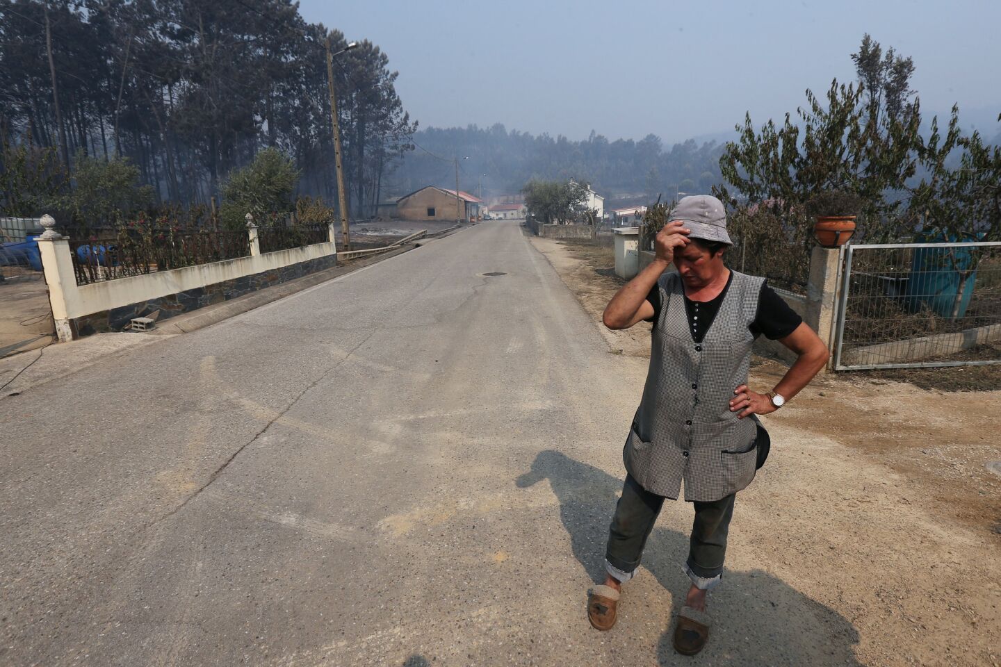 A resident of Barraca da Boavista, near Pedrogao Grande, despairs as fires rage.