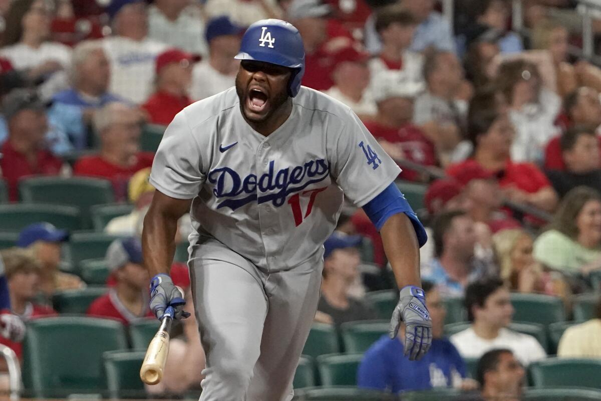 Los Angeles Dodgers' Hanser Alberto celebrates after hitting an RBI single during the ninth inning of a baseball game against the St. Louis Cardinals Wednesday, July 13, 2022, in St. Louis. (AP Photo/Jeff Roberson)