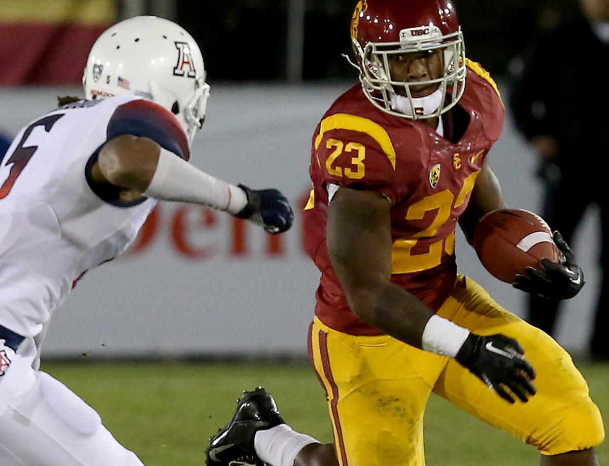 USC tailback Tre Madden runs against Arizona at the Coliseum on Oct. 10, 2013.